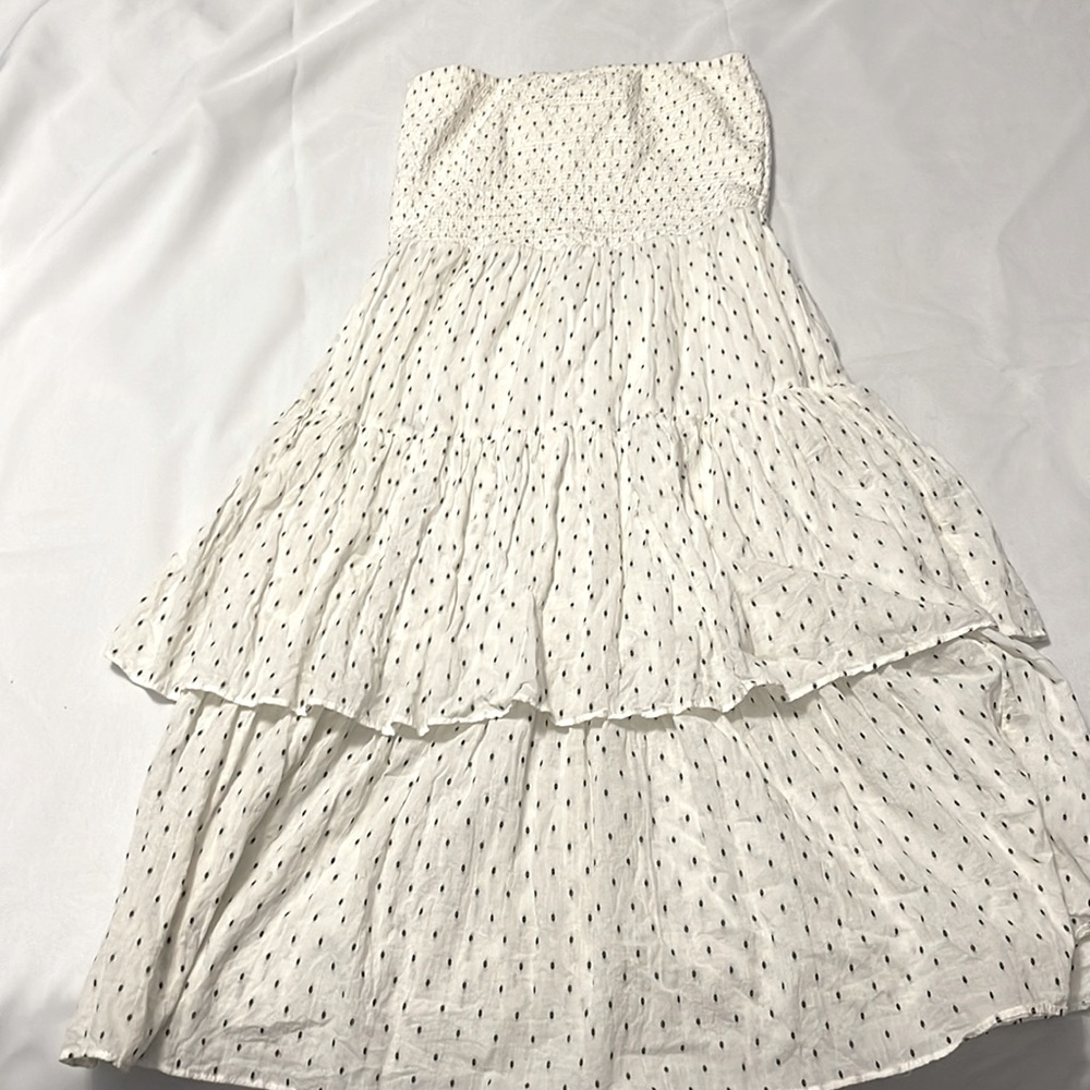 Strapless beige dress with small black print…